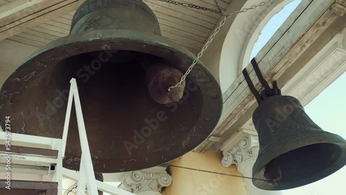 A set of bells of different sizes and sounds on the belfry of the Russian Orthodox Church and a device for the melodic sound of bell ringing on which bell ringer plays. Includes audio. Contains audio photo