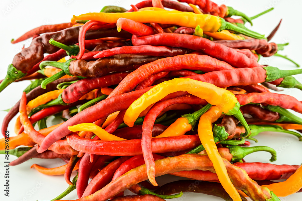 A bunch of fresh peppers on a white background A bunch of fresh peppers on a white background