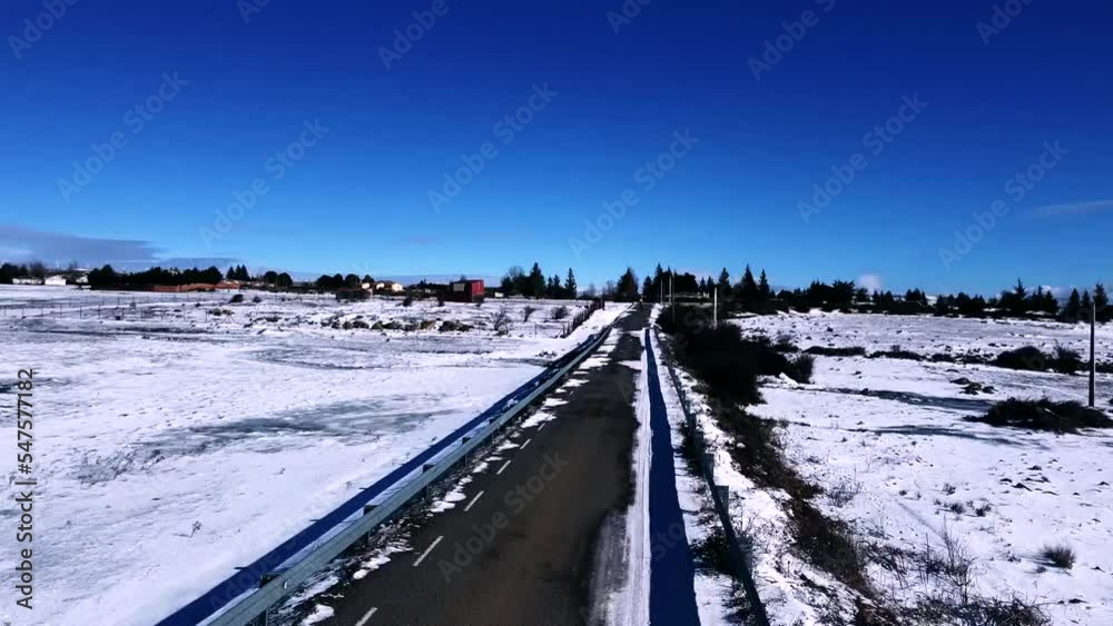Aerial video over a lonely snowy road in the interior of the mountains Aerial video over a lonely snowy road in the interior of the mountains