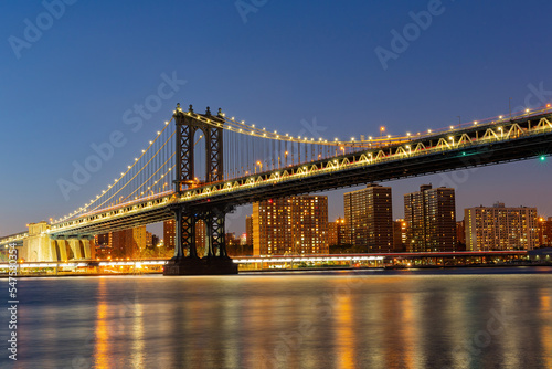 Night view of the Manhattan Bridge and New York City skyline