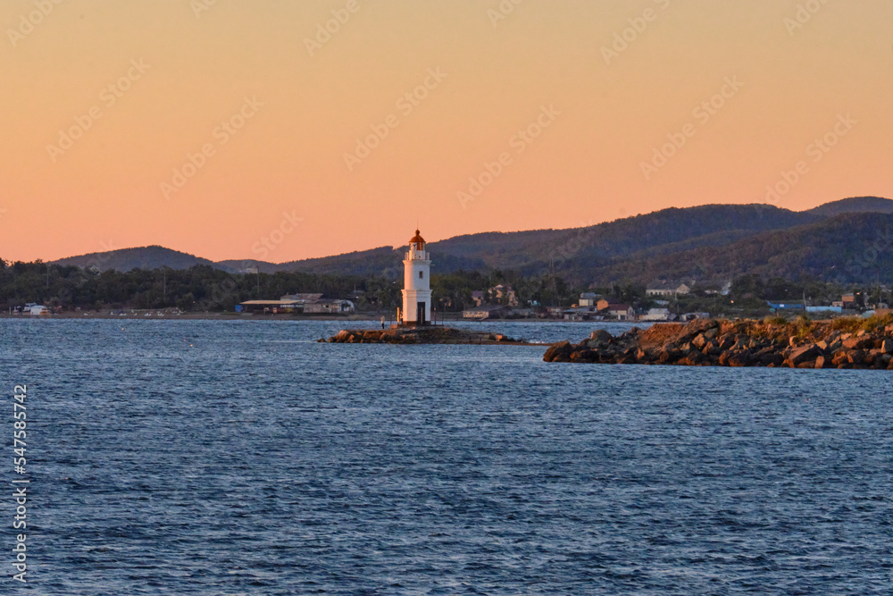 Tokarevsky lighthouse on the background of the sea. Vladivostok, Russia.