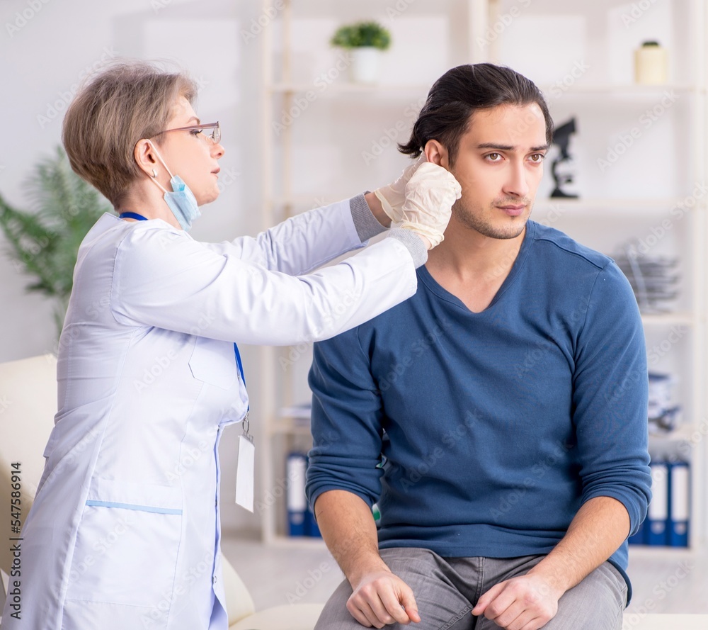 Fototapeta premium Young patient visiting doctor in hospital