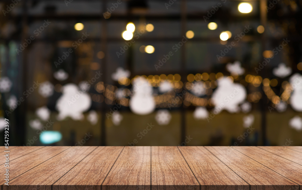 Empty wooden table top with lights bokeh on blur restaurant background. Empty wooden table top with lights bokeh on blur restaurant background.