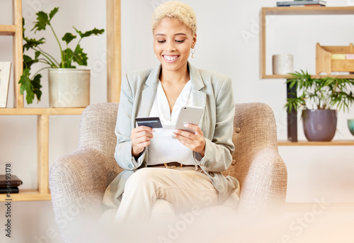 Happy, phone and business woman with a credit card for online shopping payment or financial banking online at home. Smile, finance and excited African girl customer on a fintech or ecommerce website photo