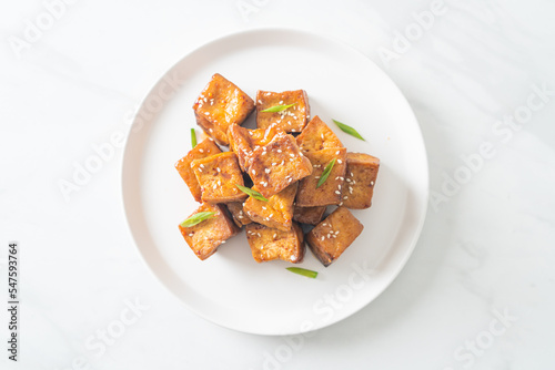 fried tofu with white sesame and teriyaki sauce