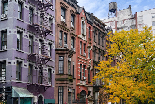 New York street with row of colorful old apartment buildings © Spiroview Inc.