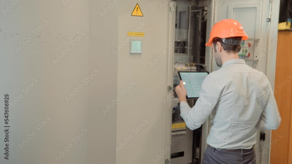 Network Engineer Working In Server Room.It Specialist On Computer Console PC.IT Technician Works With Ware And Cables in Big Data Center.Network Engineer Resolving Problem In Server Room Backup Data Network Engineer Working In Server Room.It Specialist On Computer Console PC.IT Technician Works With Ware And Cables in Big Data Center.Network Engineer Resolving Problem In Server Room Backup Data