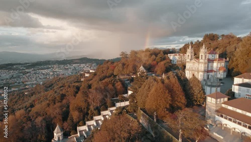 Drone footage of Bom Jesus do Monte, in Braga Portugal. Its name means Good Jesus of the Mount. Drone shows the nature that surrounds the 250 year old grounds. A rainbow is seen in the background. photo