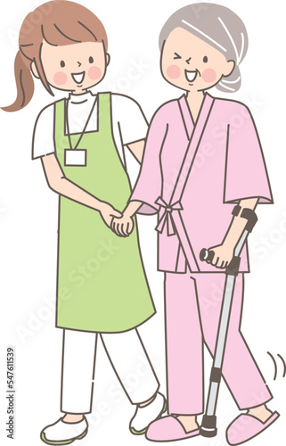 シニア女性を介助する若い介護士のイラスト