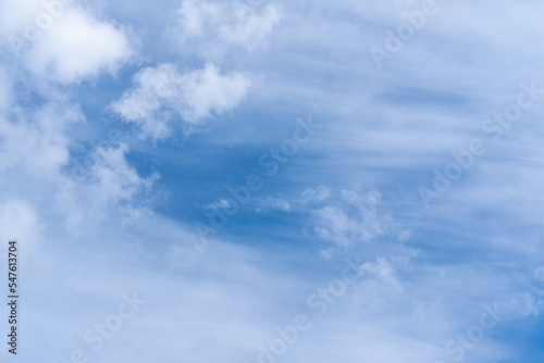 Beautiful thin cirrus clouds. Striped clouds in the morning sky. Cloud stripe line in deep blue sky day. Panorama of blue sky with white fluffy and stretched clouds