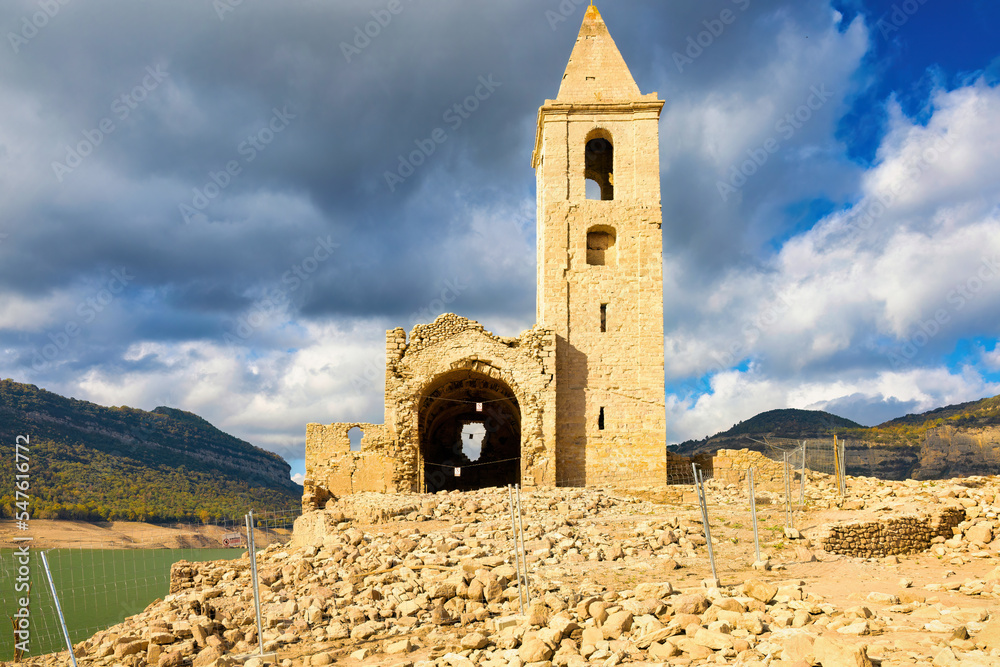 View of the state of the church of Sant Roma of Sau completely uncovered due to climate change drought, autumn 2022. Sau Reservoir, Catalonia, Spain