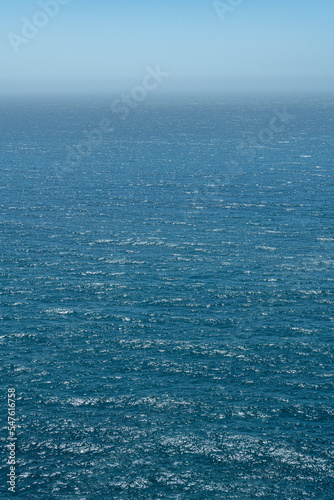 Gradient monochrome vertical photo of Pacific ocean, Big Sur, California