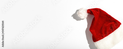 Fotografia Santa Claus red hat isolated from above on colorful background