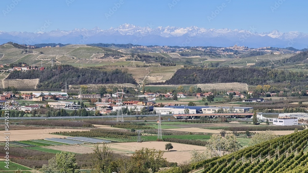 Alba, Italy-November 5, 2022: Beautiful hills and vineyards during fall season surrounding Alba village. Beautiful natural landscape from the small villages near Cuneo. 
