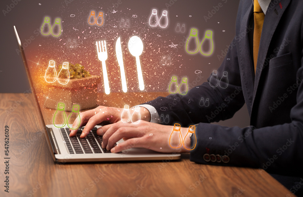 Hand searching for recipes on the internet Hand searching for recipes on the internet