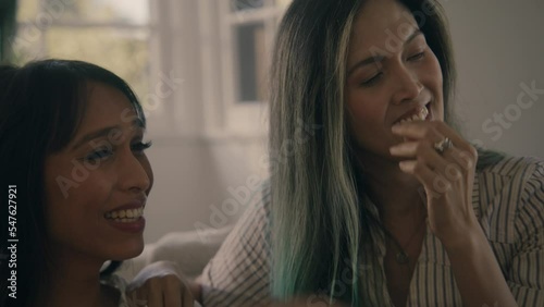 woman teases her friend about something and they laugh