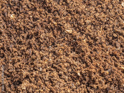 Ground coffee powder isolated on white background..Used coffee grounds after espresso machine and coffee beans on white background.Caffeine addiction concept.