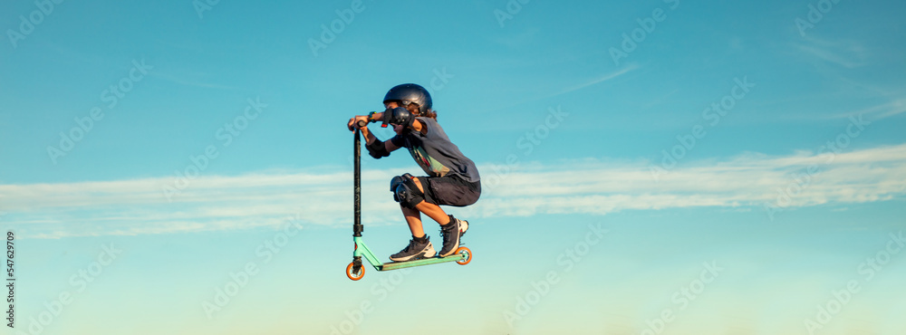 young boy jumping with scooter freestyle young boy jumping with scooter freestyle