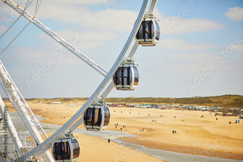Fotografia Ferris wheel on the beach in Scheveningen, The Hague, Netherlands