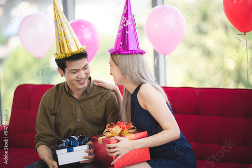 Cheerful young couple celeb...
