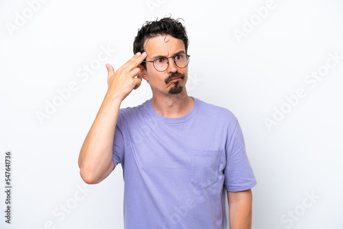 Young man with moustache isolated on white background with problems making suicide gesture