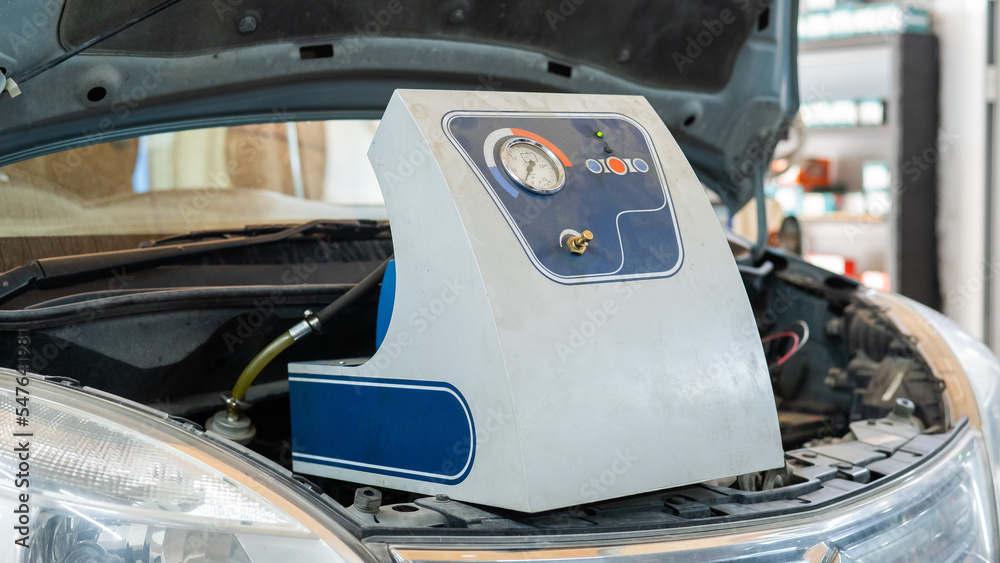 Automated change of brake fluid in a car service. Car bonnet. Automated change of brake fluid in a car service. Car bonnet.