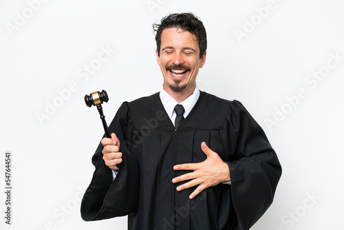 Young judge caucasian man isolated on white background smiling a lot
