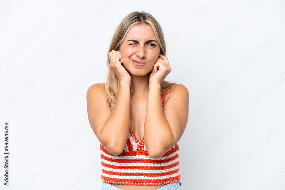 Young caucasian woman isolated on white background frustrated and covering ears Young caucasian woman isolated on white background frustrated and covering ears