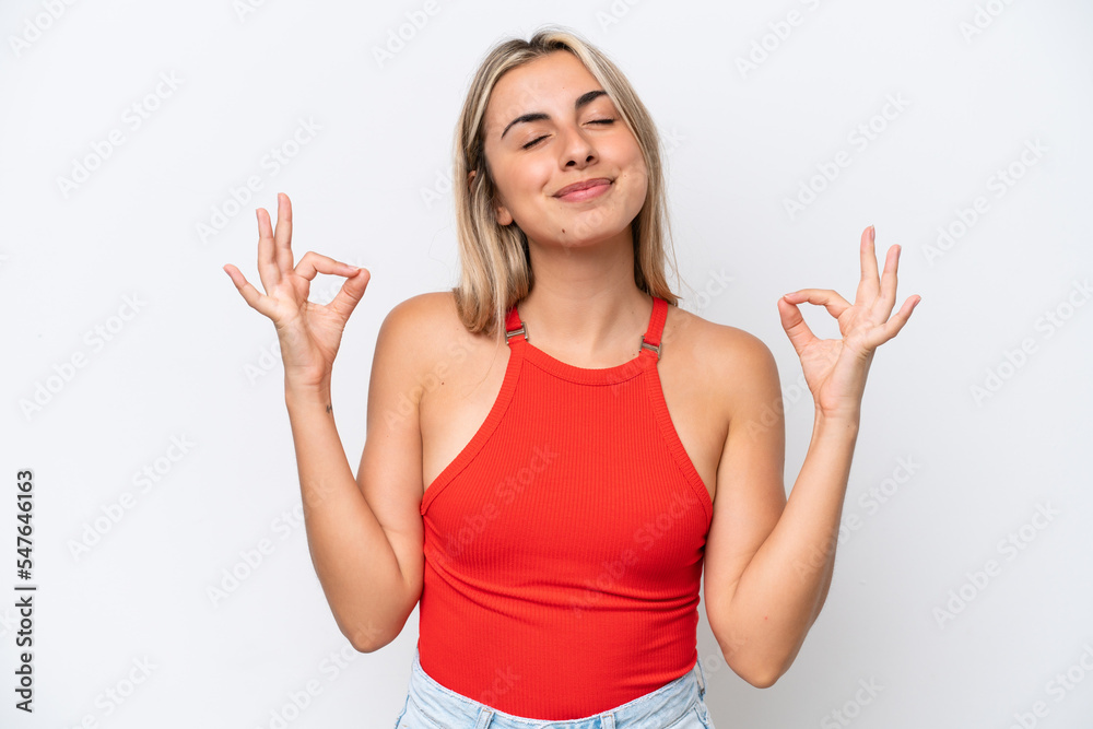 Fototapeta premium Young caucasian woman isolated on white background in zen pose