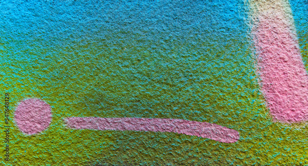 Colorful aerosol street wall background. Urban modern art texture. Wallpaper design backdrop pattern.