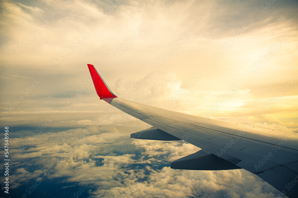 Morning sunrise with Wing of an airplane. Photo applied to tourism operators. picture for add text message or frame website. Traveling concept Morning sunrise with Wing of an airplane. Photo applied to tourism operators. picture for add text message or frame website. Traveling concept