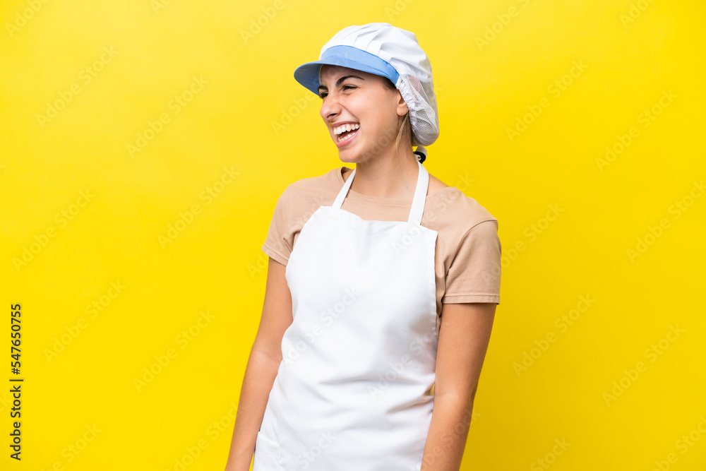 Fishwife woman over isolated background laughing in lateral position Fishwife woman over isolated background laughing in lateral position