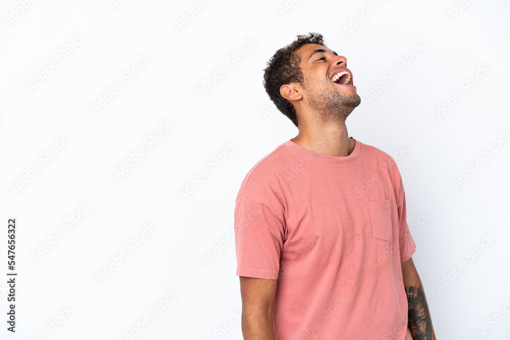Young handsome Brazilian man isolated on white background laughing Young handsome Brazilian man isolated on white background laughing