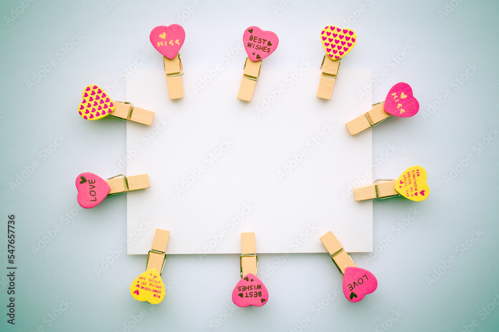 Abstract of wooden heart clip with Blank paper and stick paper on refrigerator door. paper note copy space for add text.