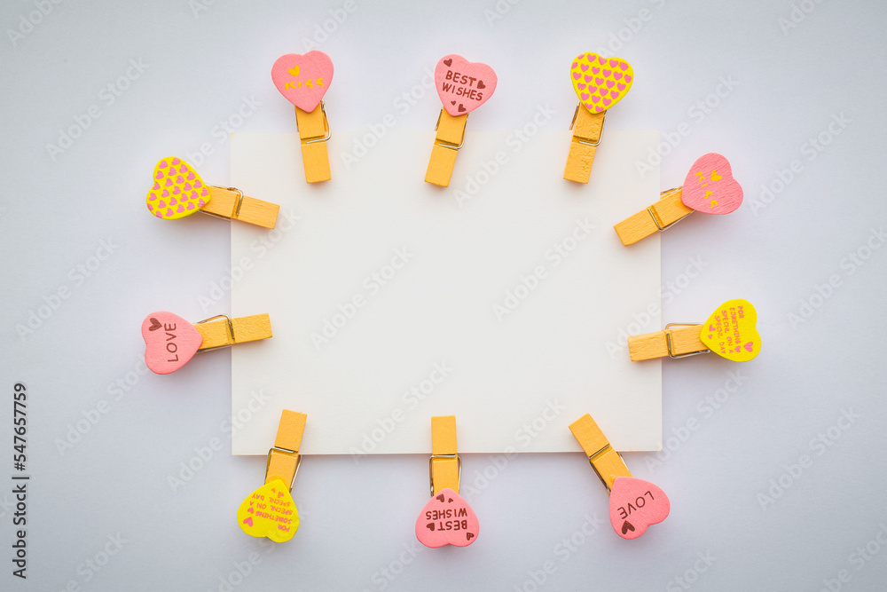 Abstract of wooden heart clip with Blank paper and stick paper on refrigerator door. paper note copy space for add text. Abstract of wooden heart clip with Blank paper and stick paper on refrigerator door. paper note copy space for add text.