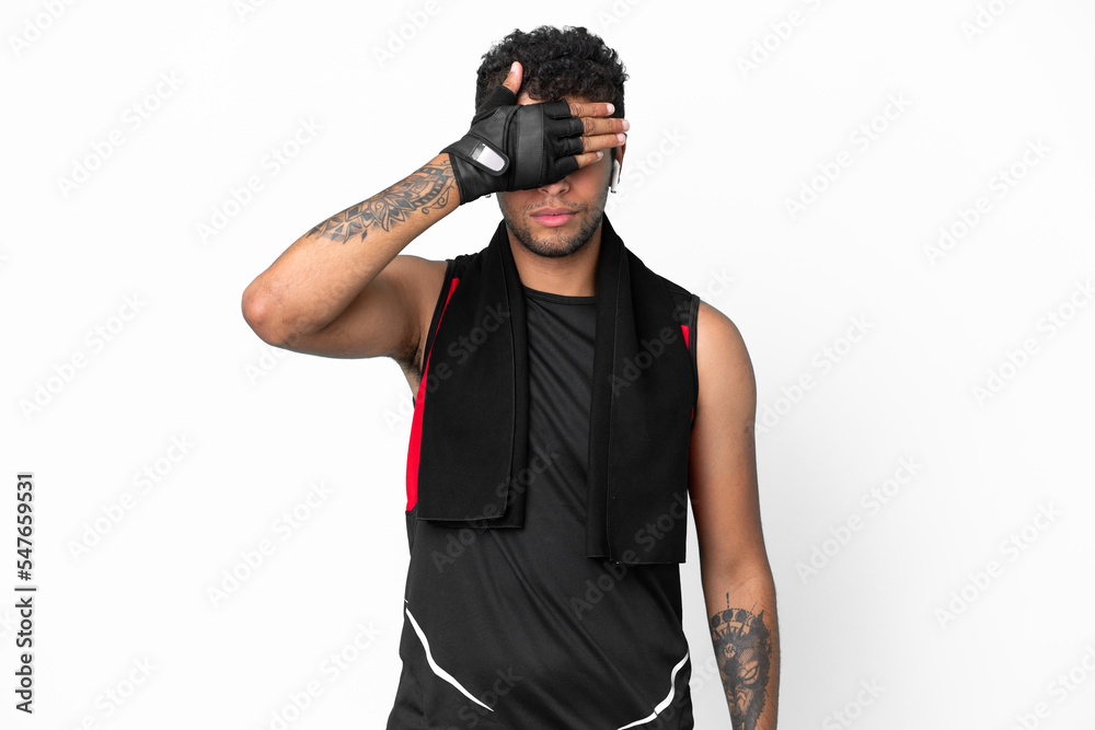 Sport brazilian man with towel isolated on white background covering eyes by hands. Do not want to see something Sport brazilian man with towel isolated on white background covering eyes by hands. Do not want to see something