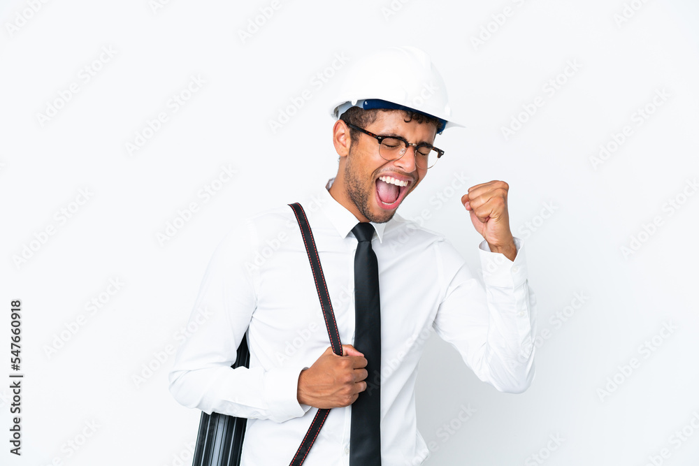 Architect brazilian man with helmet and holding blueprints celebrating a victory Architect brazilian man with helmet and holding blueprints celebrating a victory
