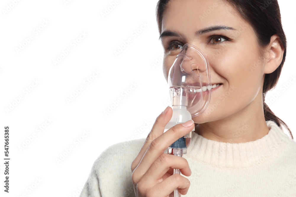 Young woman with nebulizer on white background, closeup Young woman with nebulizer on white background, closeup