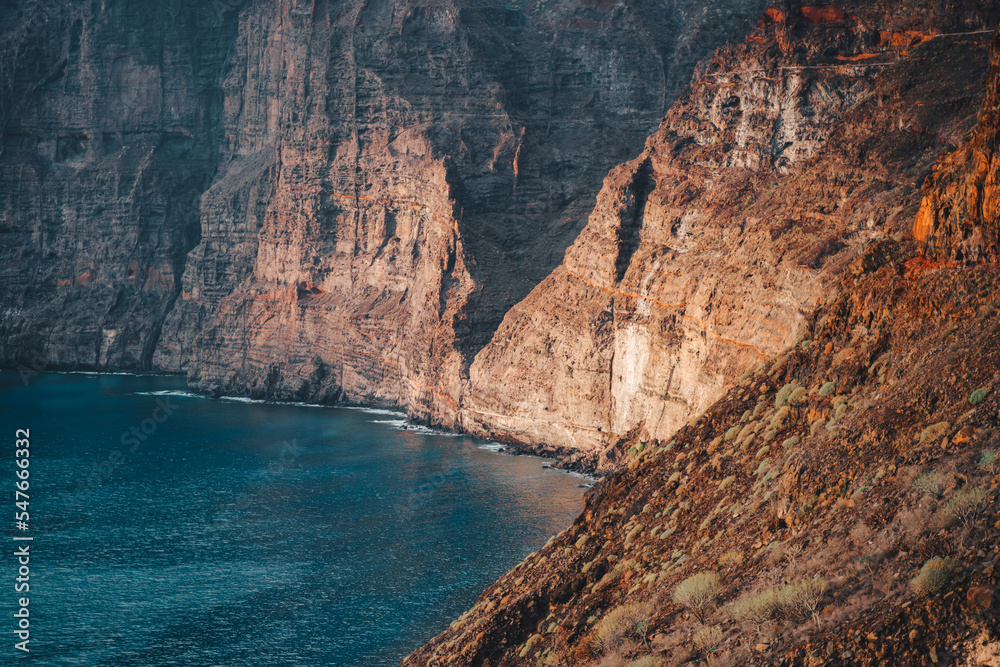 Los Gigantes cliffs, mountain ranges and deep ocean view at sunset. Tenerife. Santiago del Teide. Canary Islands, Spain. Close up. Detailed high quality image.