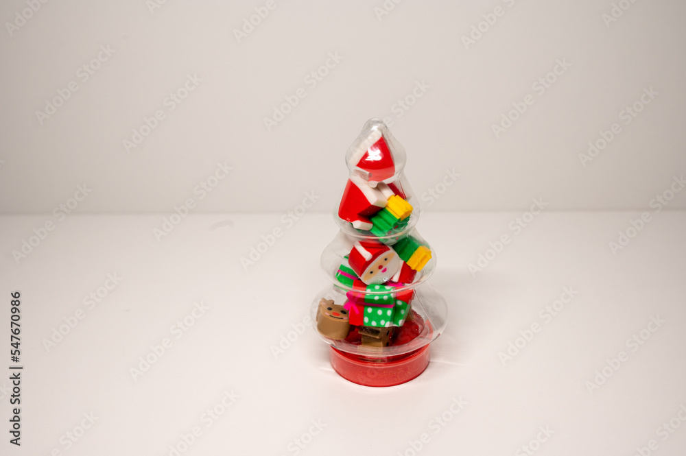 Christmas tree style toy, filled with holiday shaped erasers
