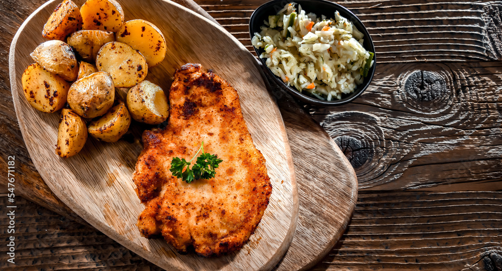 Chicken cutlet coated with breadcrumbs with potatoes and cabbage Chicken cutlet coated with breadcrumbs with potatoes and cabbage
