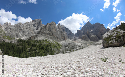 scree of white stones in the middle of the Italian Alps in summer photo