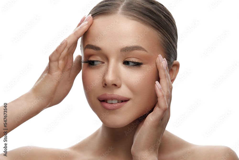 Skin care. Woman with beauty face touching healthy facial skin portrait. Beautiful smiling girl model with natural makeup touching her skin Skin care. Woman with beauty face touching healthy facial skin portrait. Beautiful smiling girl model with natural makeup touching her skin