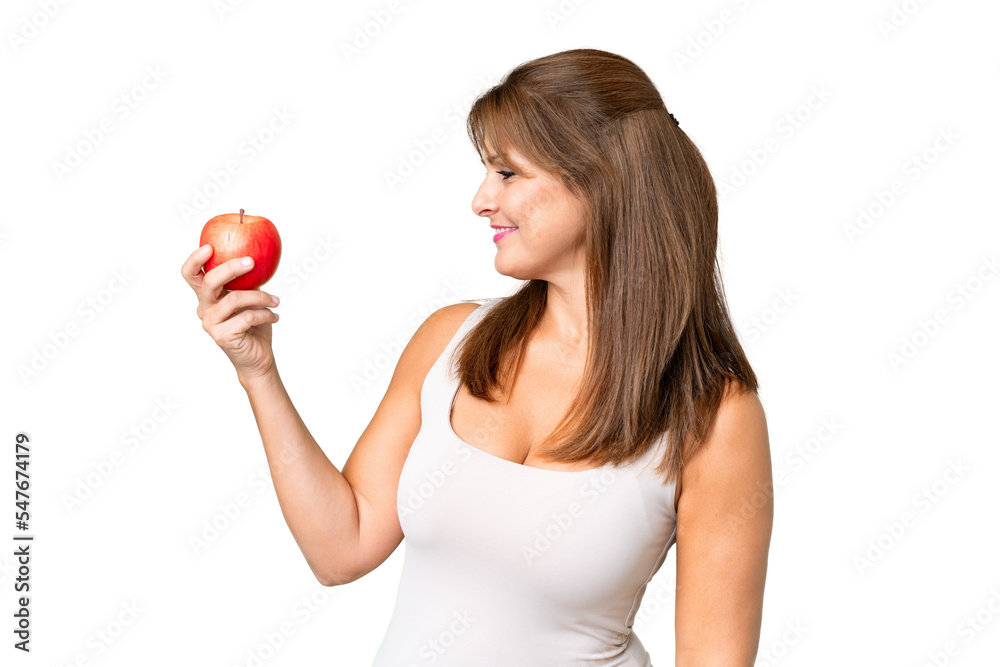 Middle age woman with an apple over isolated background with happy expression Middle age woman with an apple over isolated background with happy expression