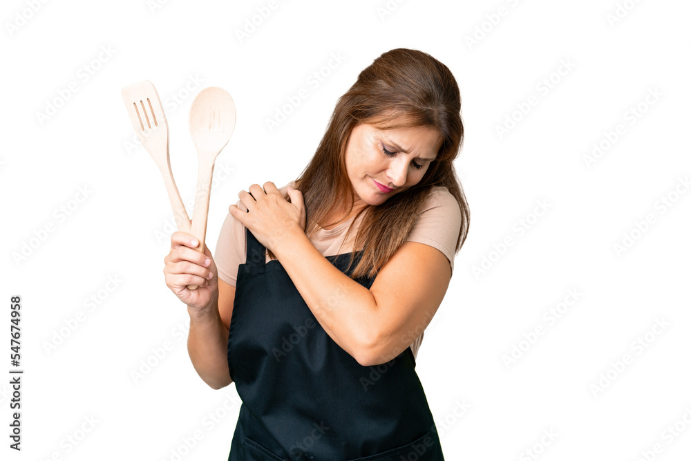 Middle age caucasian woman holding a rolling pin over isolated background suffering from pain in shoulder for having made an effort Middle age caucasian woman holding a rolling pin over isolated background suffering from pain in shoulder for having made an effort