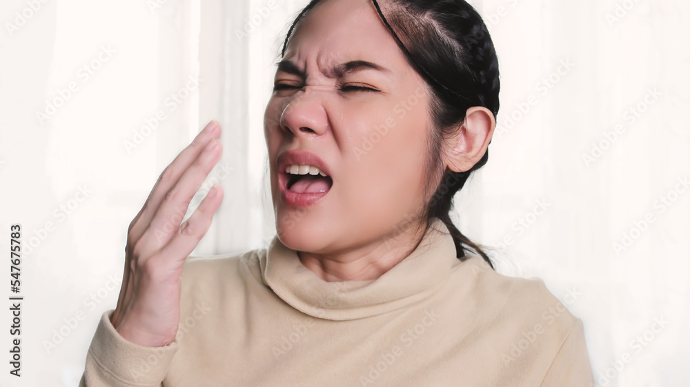 Asian beautiful woman is sneezing cause from COVID19 and sick. Asian beautiful woman is sneezing cause from COVID19 and sick.