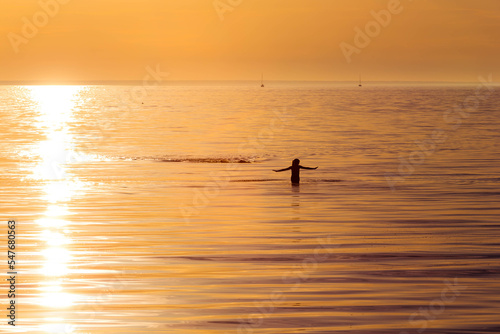 ocean woman in sunset light © romantsubin