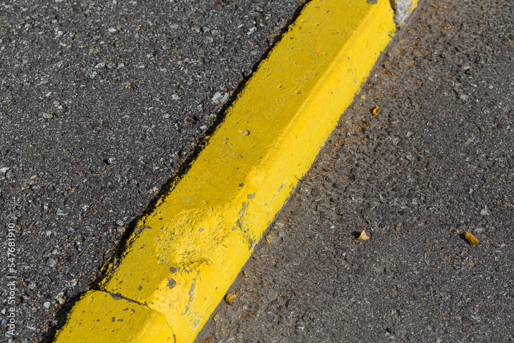 Fototapeta premium Yellow curb stone border
