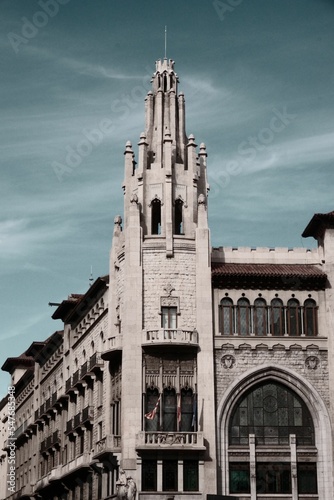 Vertical of a skyline of a gothic architectural building at Vie Laietana street in Barcelona photo