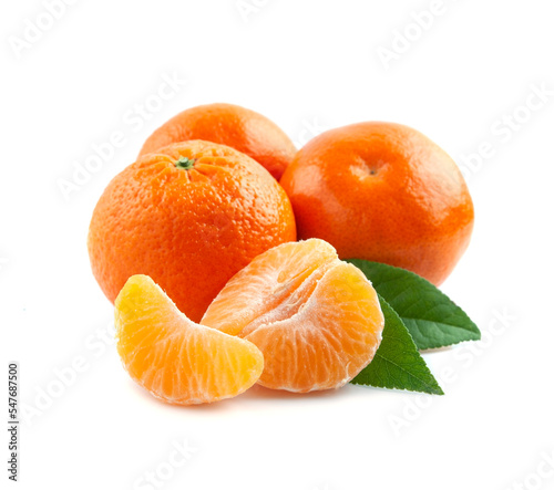 Ripe tangerine fruits with leaves with slices mandarin on white backgrounds.